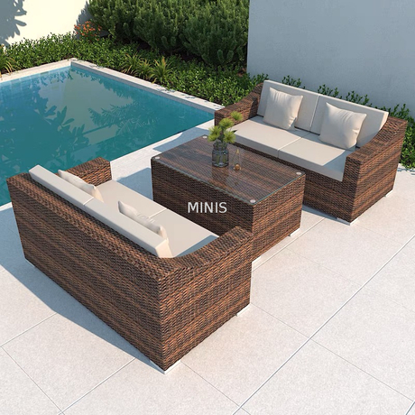 Divano da giardino in rattan marrone per esterni con tavolo in vetro